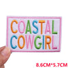 Pink embroidered patch with colorful letters COASTAL COWGIRL in orange green and purple thread