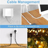 Self-adhesive cable clips used for cord management on a desk and plant wires.