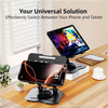 A black 360° rotating carbon steel tablet stand holding an iPhone and a tablet on a wooden desk.