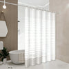 A white shower curtain with vertical stripes hangs from a rod in a modern bathroom setting.