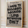 Framed canvas wall art featuring a black and white newspaper-style quote about liking expensive shit