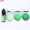A set of concentrated liquid candle dye in grass green color shown with dropper bottles and various drop quantities