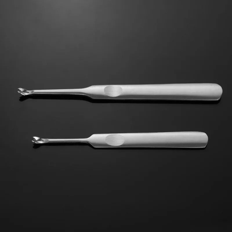 A set of four leather edge groover and beveler tools made of polished metal.