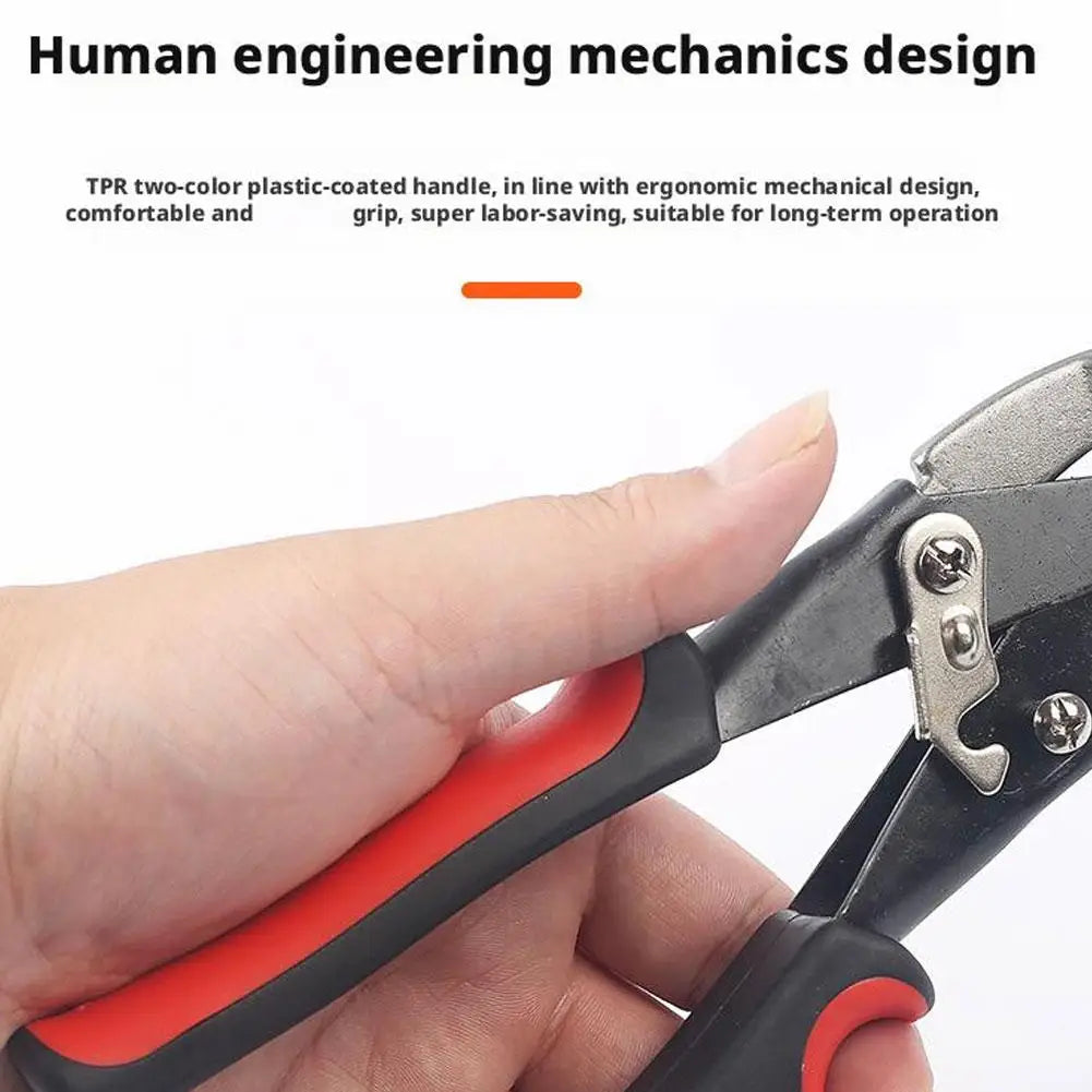 A hand is holding heavy-duty aviation snips with a red and black handle, showing the ergonomic design.