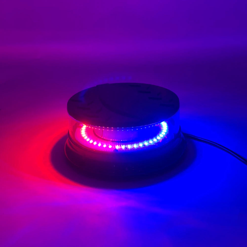 A magnetic mount LED emergency strobe light emitting bright red and blue light against a dark background.