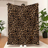 A brown and black leopard print flannel throw blanket displayed on a white rug.