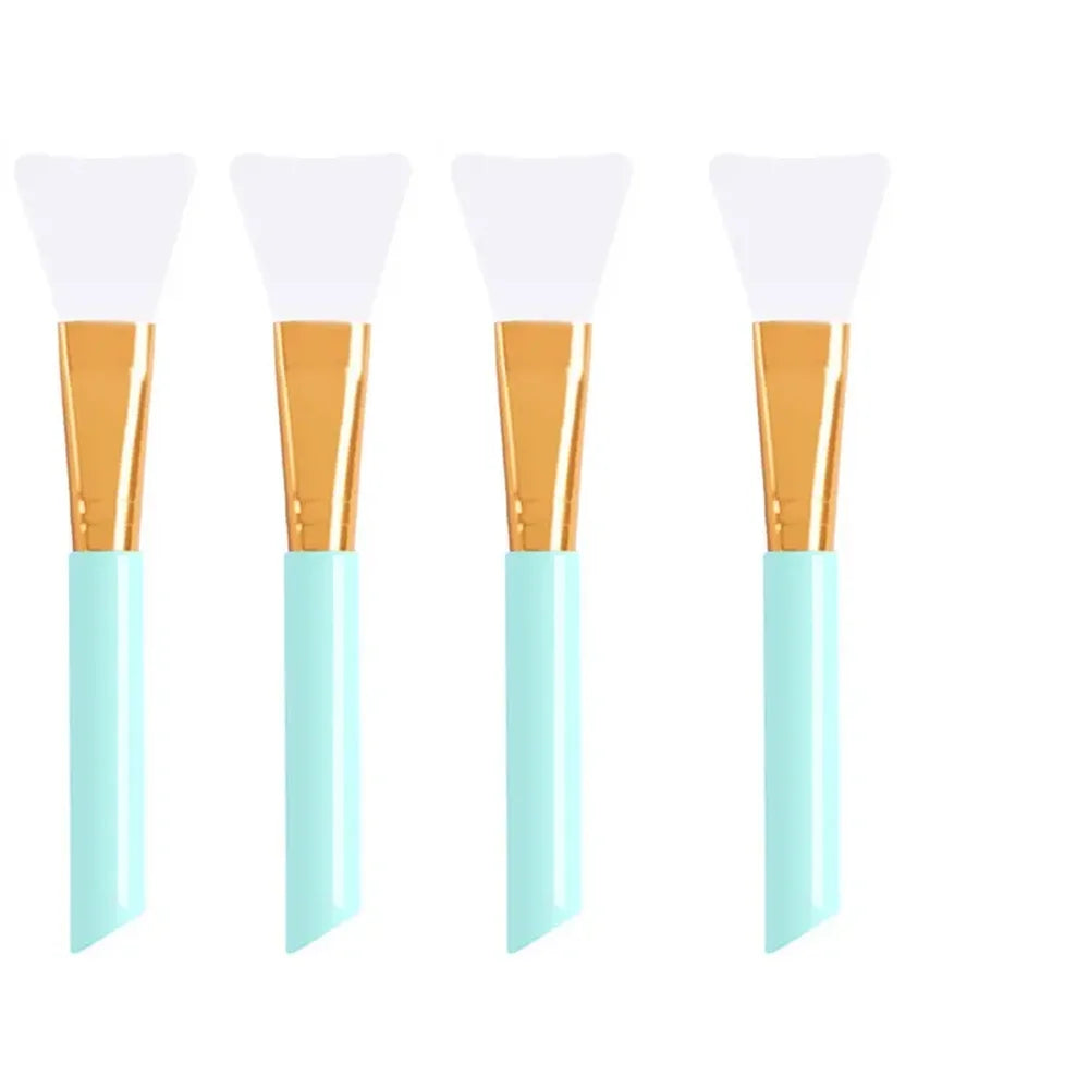A set of silicone facial mask brushes with wooden handles and light blue bases.