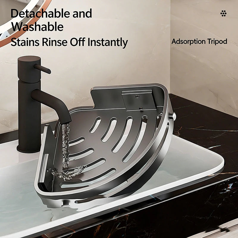 A stainless steel detachable and washable adsorption tripod shower caddy with suction cups shown on a glass surface.