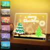 A display of seven LED drawing boards with various festive drawings and a glowing Christmas theme.
