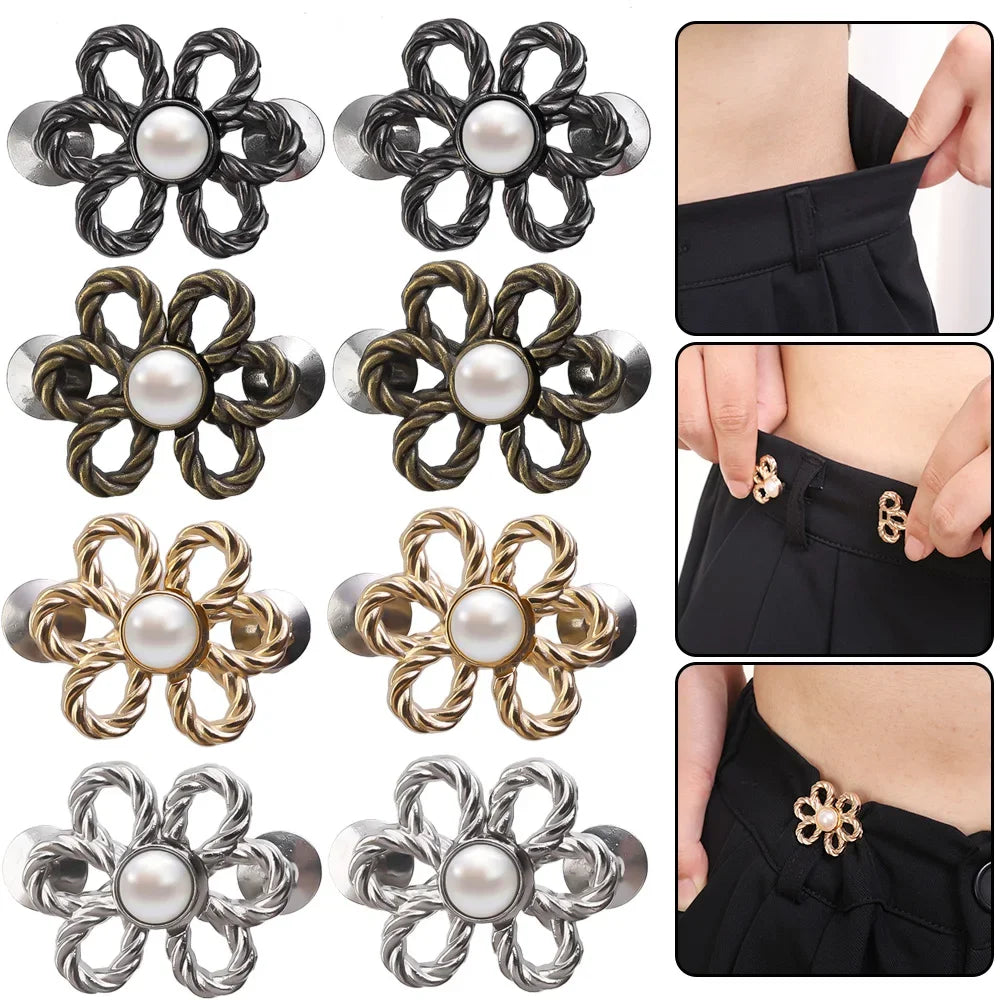 A collection of adjustable flower waist clips in silver, gold, and dark metal finishes for pants and jeans.