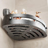 A silver corner shower caddy with suction cups holds two bottles of liquid soap and a lotion.