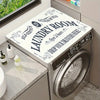 A silver laundry room appliance with a top cover mat displaying text encouraging people to drop their drawers here.