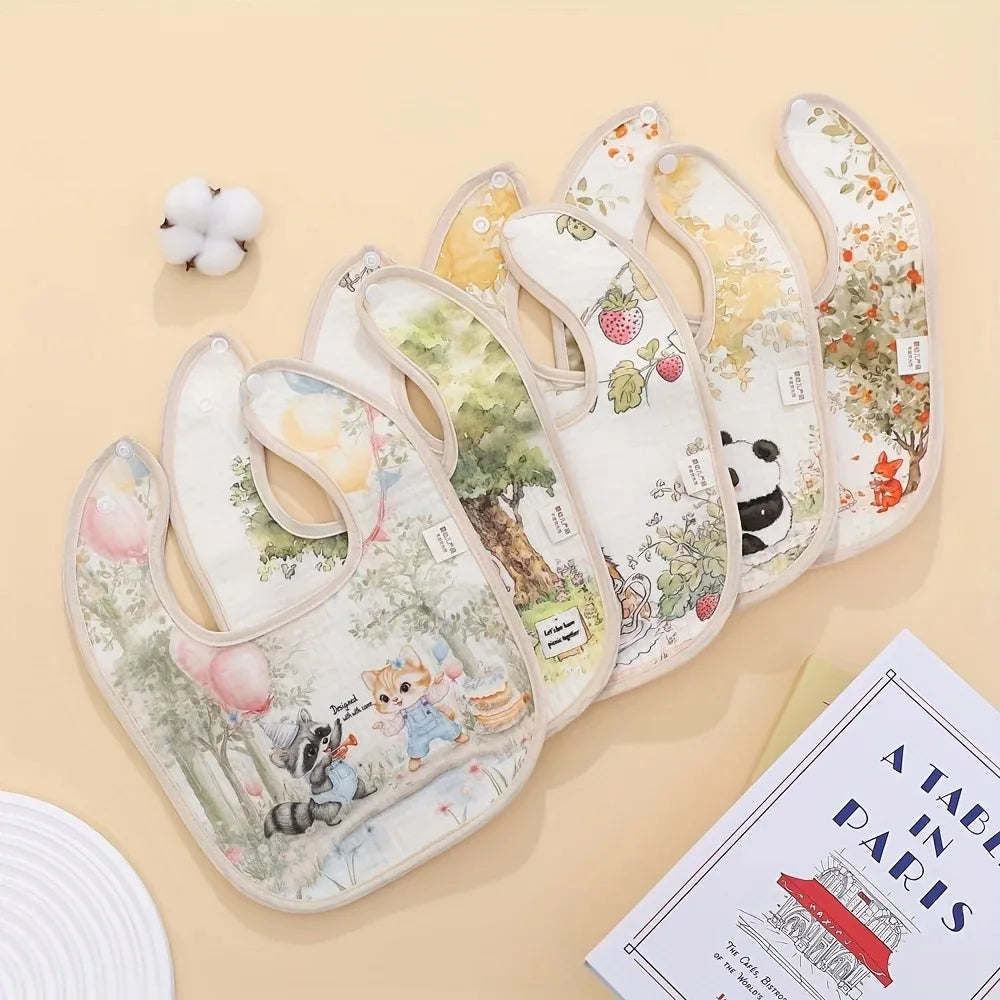 A set of soft cotton waterproof baby bibs with adjustable necks featuring floral and animal patterns.