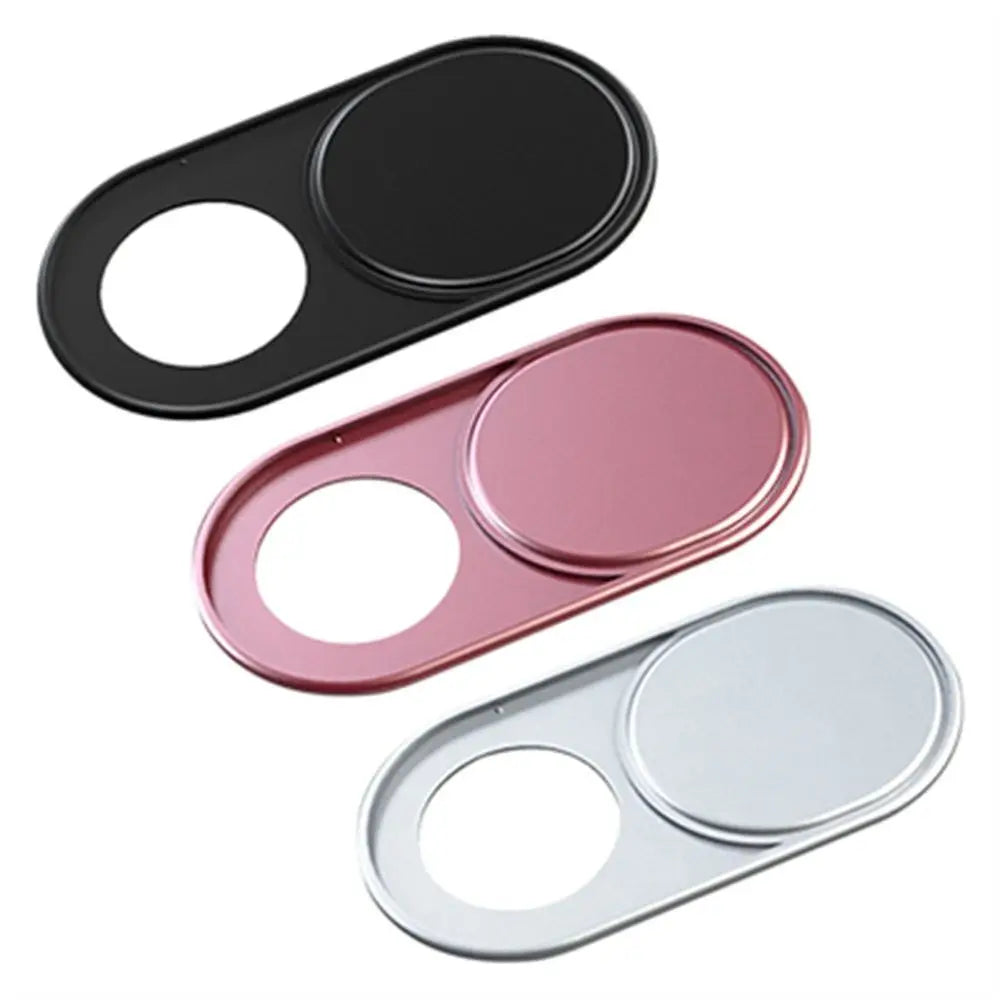 Three magnetic webcam covers in black, pink, and silver for laptops, tablets, and phones