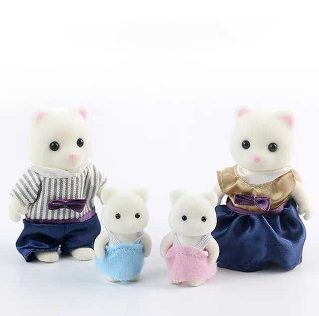 A set of three white miniature animal dolls dressed in clothing, including a top, shorts, and a skirt.