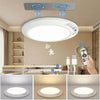 A rechargeable ceiling light with a magnetic mount and remote control is shown above a modern living room setting.