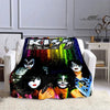 A black and colorful print featuring stylized faces of the Kiss band members on a flannel throw blanket.