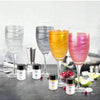 A collection of sparkling drinks in various colors, including gold and pink, set against a gray background.