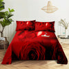 Red rose themed bedding set featuring a large floral print on a bed with matching pillows.