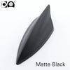 A matte black 5D shark fin car antenna for FM/AM signal reception.