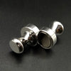 A close-up shot of silver neodymium magnetic pushpins, showing their round heads and shaft.