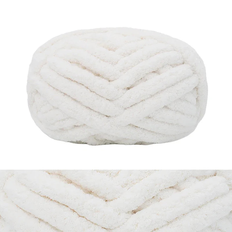 A ball of white chunky chenille yarn with a ribbed texture.