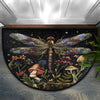 A half-round doormat featuring a detailed illustration of a colorful dragonfly among various plants and fungi.