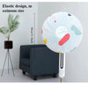 A white, elastic design dust cover for an electric fan is shown against a white wall.