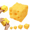 Yellow cheese-themed squishy stress relief toys in various shapes and sizes