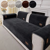 A black striped sofa cushion cover displayed on a white sofa, with fabric swatches shown in the upper corners.