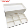 White plastic drawer organizer tray with multiple compartments for dental instruments