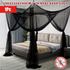 Black floor-to-ceiling mosquito net with double opening draped over a bed.