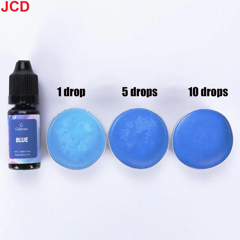 A set of blue liquid candle dye in a dropper bottle with corresponding colored discs for DIY candle making