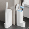 A white disposable toilet brush set with a handle and replaceable heads is shown next to a toilet.