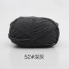 A ball of dark gray soft 4-ply milk cotton yarn for knitting and crochet.