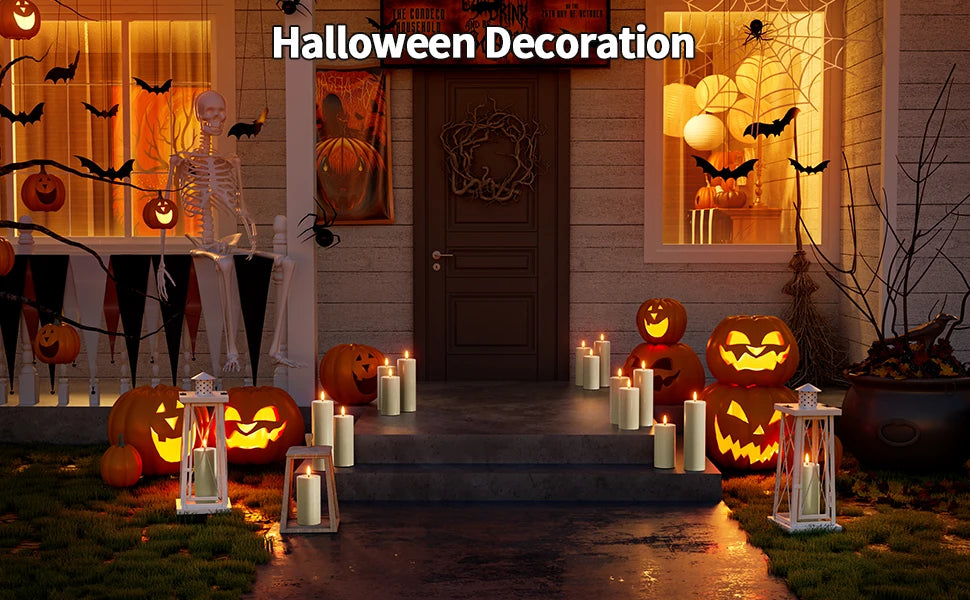 Halloween decoration featuring carved pumpkins, spooky silhouettes, and glowing pillar candles on a porch.
