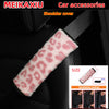 A pink leopard print shoulder cover for a car seat, shown in an installation guide.