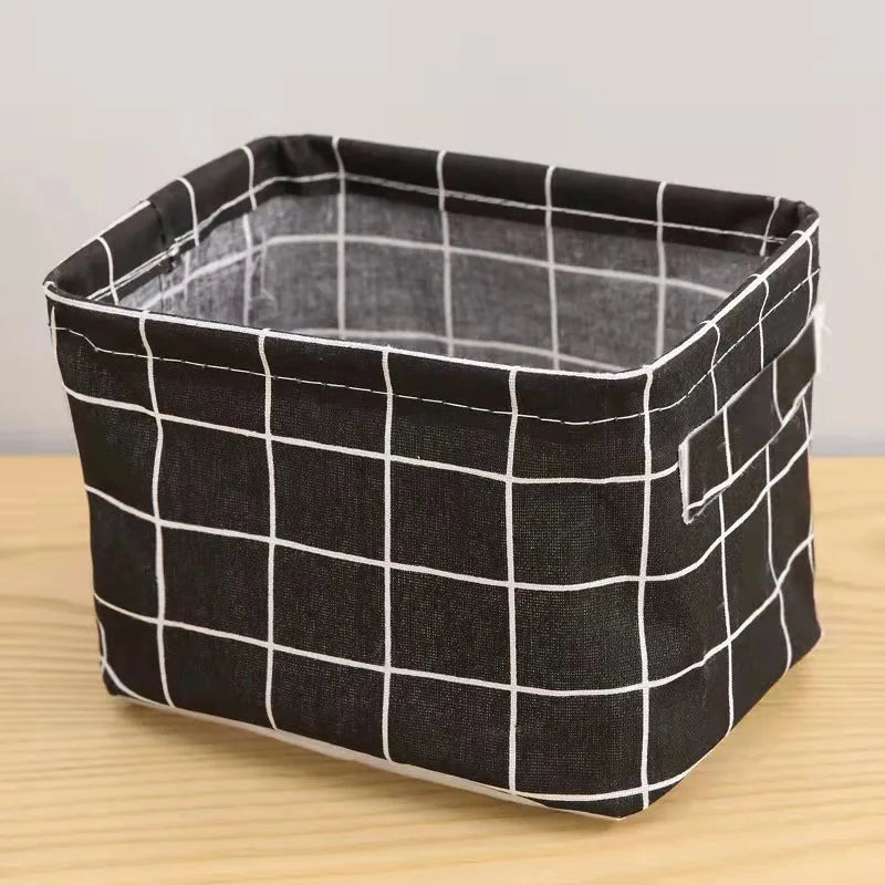 Black and white checkered storage basket with handles made of cotton and linen.
