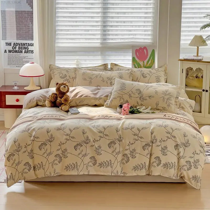 A beige and cream pure cotton bedding set featuring a duvet cover, fitted sheet, and pillowcases on a bed.