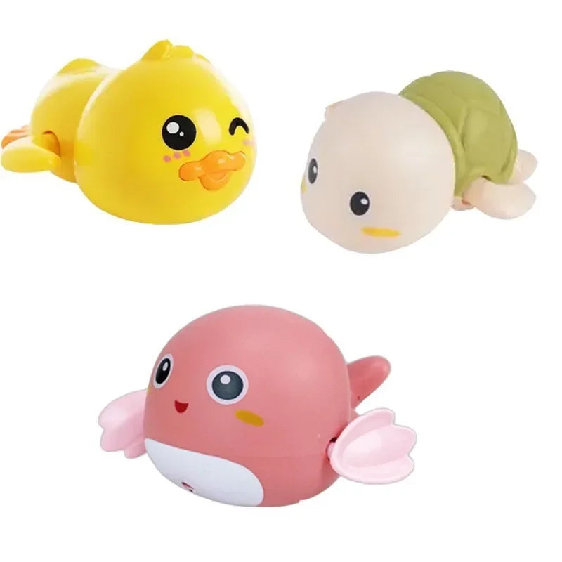 A set of three wind-up bath toys featuring cartoon turtles, ducks, and whales in yellow, beige, and pink.