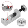 A silver watch band link remover and pin extractor kit with a tool and a removable disc.