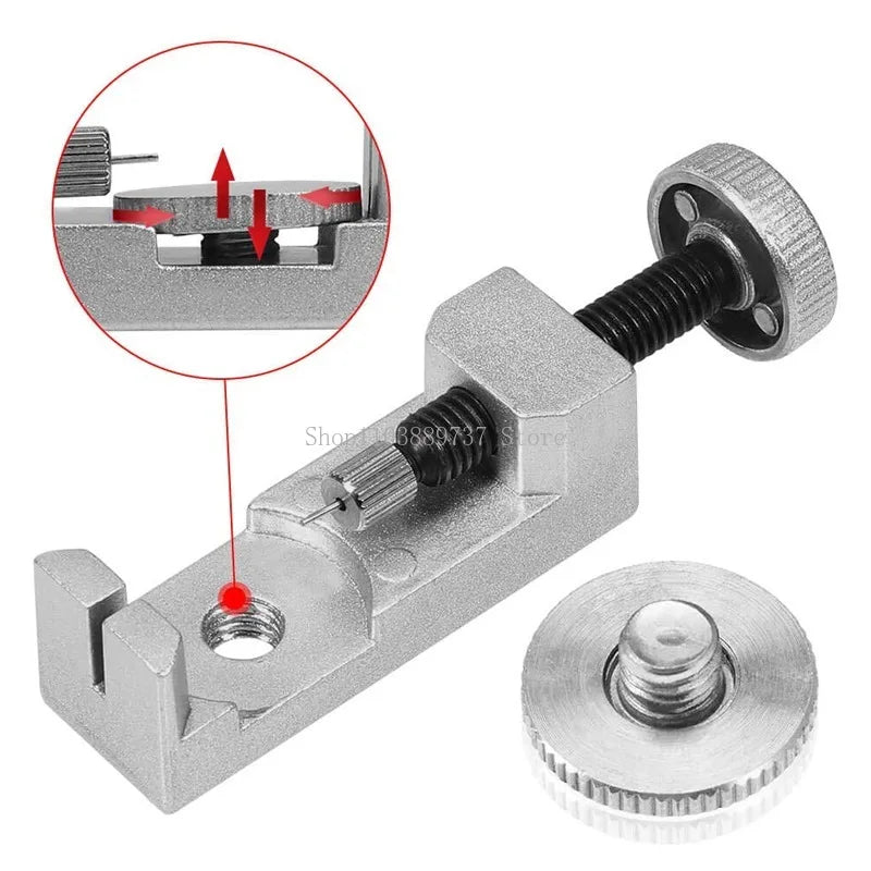 A silver watch band link remover and pin extractor kit with a tool and a removable disc.