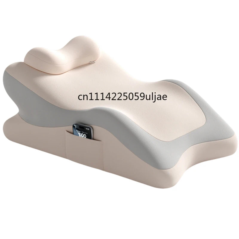 A beige memory foam full-body support pillow with a gray accent, shown from the side.