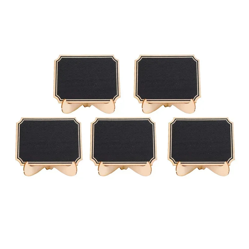 A set of six small, rectangular wooden chalkboard signs with gold accents.