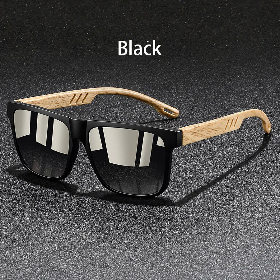 Black vintage square sunglasses with wooden arms shown on a dark surface.
