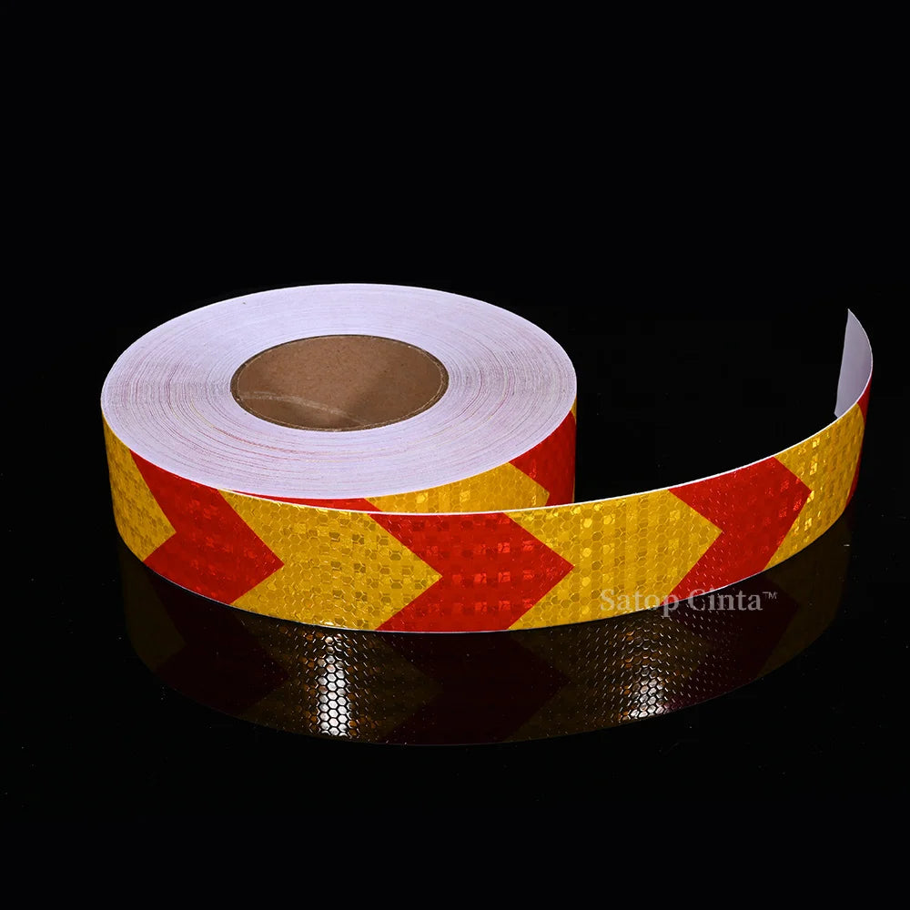 Roll of yellow and red high-visibility reflective safety tape for vehicles