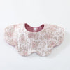 A pink floral patterned baby feeding bib made of 6-layer cotton with a small button closure.