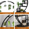 A black metal plant stand featuring five tiers, a curved design, and hanging hooks for indoor plants.