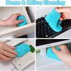 Hands cleaning a laptop keyboard with blue reusable gel for home and office cleaning