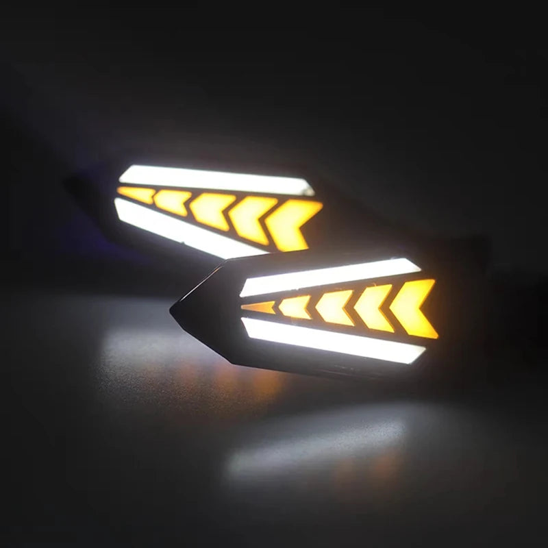 A close-up of a motorcycle LED flowing turn signal indicator with a bright white light and yellow chevron pattern.